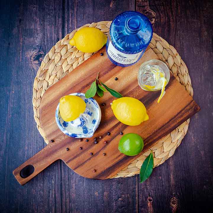 Lemons and limes on a chopping board