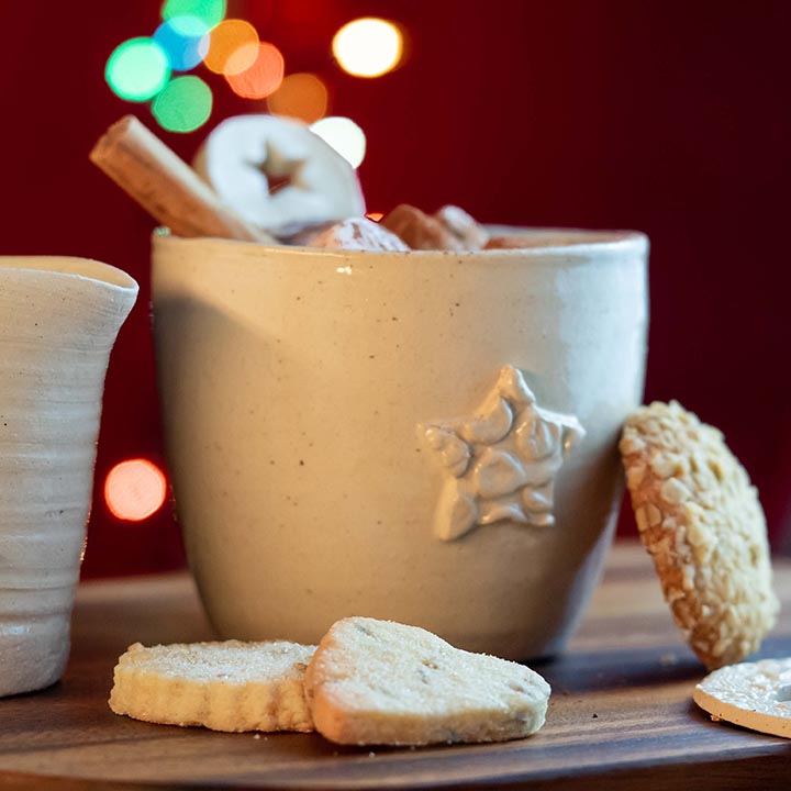 A mug pictured with shortbread biscuits